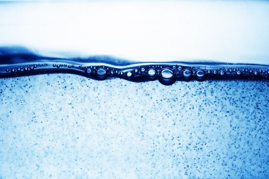 close up of water bubbles in a glass