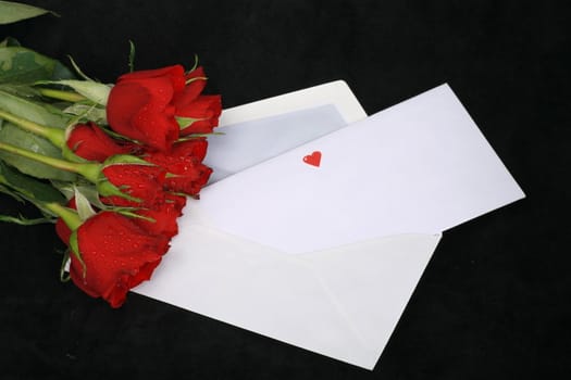 a loveletter on a dark background with rose and heart...........