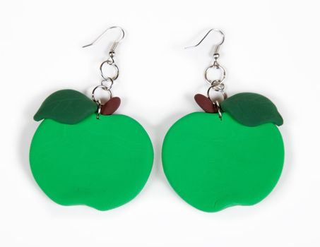 Earrings apples on a white background