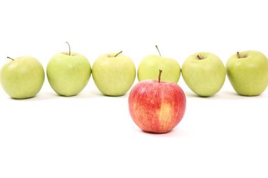 apples arranged on a white background to symbolize teamwork, leadership, discrimination............