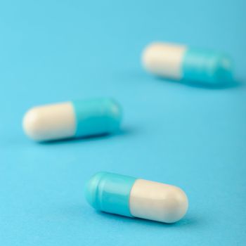 set capsules on blue background. Photo closeup