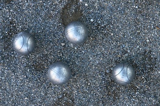 silver boccia ball on the ground