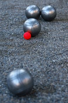 silver boccia ball on the ground