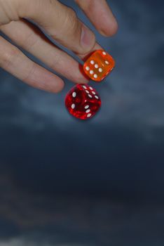 hand throwing dices.