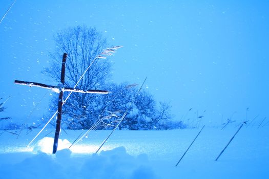 Cross in winterscene