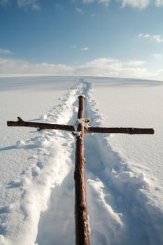 Cross in winterscene