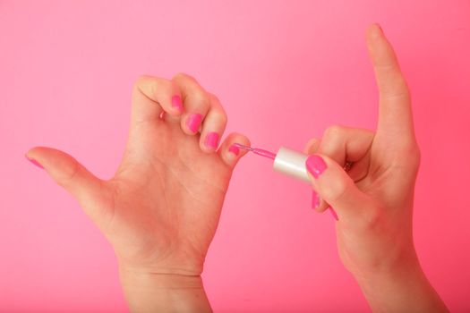 close-up of a woman painting her nails