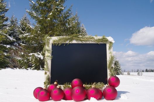 a decorated screen in snowy winter landscape