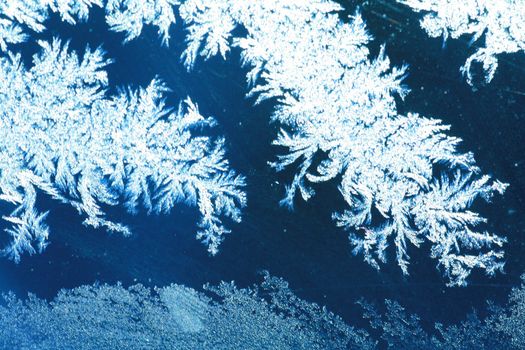 The patterns made by the frost on the window (hoarfrost background)