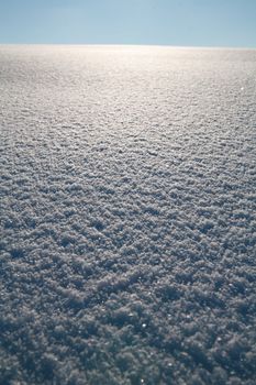 Details of a beautiful snow surface perfect for backgrounds on greeting cards etc.