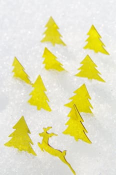 golden trees on a real snowy icy surface