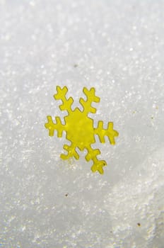 golden snow stars on a real snowy icy surface