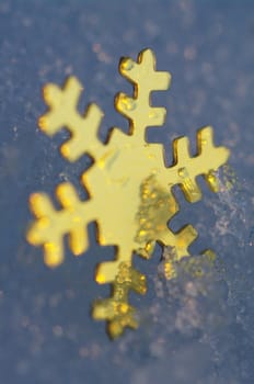 golden snow stars on a real snowy icy surface