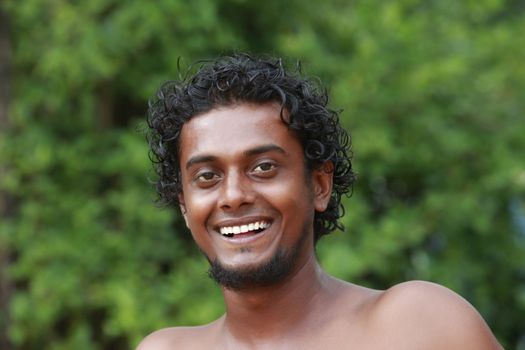 Portrait young men on a green background. Sri Lanka