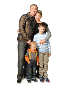 Happy family. The daddy, mum, two sons. It is isolated on a white background.