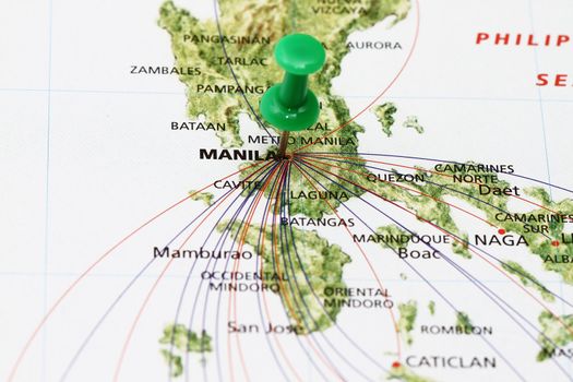 Manila Philippines with pin and airplane route.