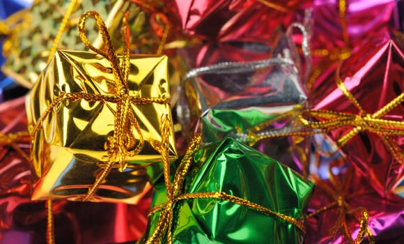 Set of gifts in boxes. Bright brilliant surfaces
