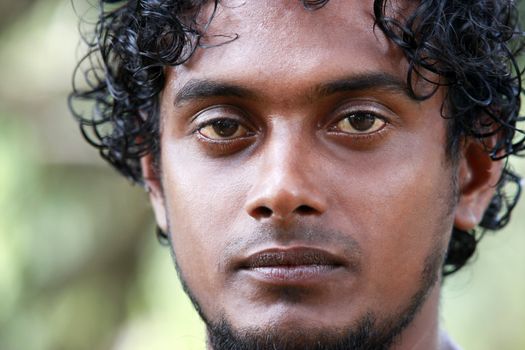 Portrait young men on a green background. Sri Lanka