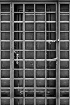 Wooden door and protective metal frame.