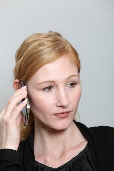 Sad, young woman on the phone. She looks disappointed right.