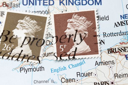 Old  postage stamp with UK map as the background.
