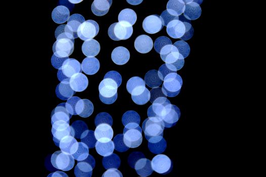 Out of focus blue light circles. Abstract bokeh effect background.