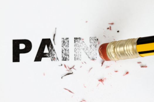 Removing Pain concept with eraser and pencil.