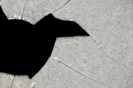 Broken glass fragments surface texture. Abstract background.