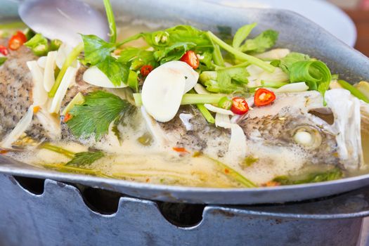 Snapper steamed lemon on a hot pot.