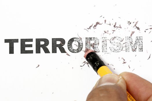 Wiped out Terrorism concept - eraser and word terrorism erased.