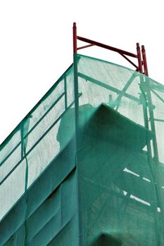 Debris netting and scaffold at construction site.