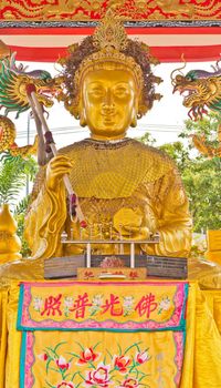 Guan Yin gold statues, and statues dragon sacred, in Chinese temple.