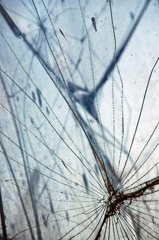 Shattered glass fragments surface texture. Abstract background.