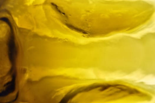 Yellow glass reflections macro. Abstract background pattern.