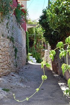 Narrow road and traditional houses in Keri village, island of Zakynthos, Greece.