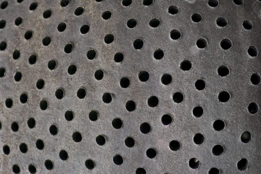 Holes pattern on ceramic surface. Abstract background.