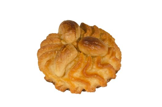 pastry decorated with cashew nuts isolated on a white background