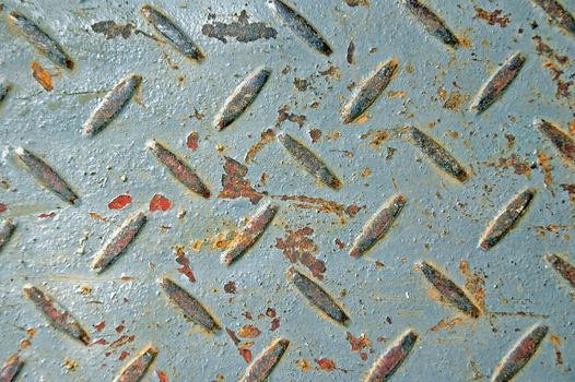 Rusty chipped paint industrial anti slip metal texture.