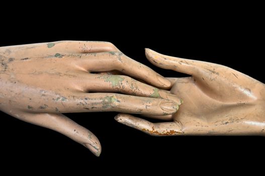 Weathered hands of plastic mannequin doll.