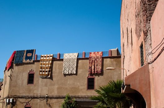Moroccan building with newly produced Berber carpets in the Medina of Marrakech