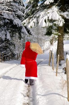 Santa Claus, Father Christmas in a beautiful winter landscape