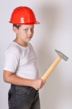 Portrait of a boy in a red protective helmet