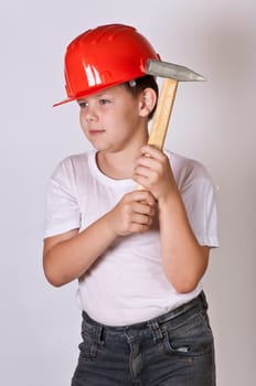 Portrait of a boy in a red protective helmet