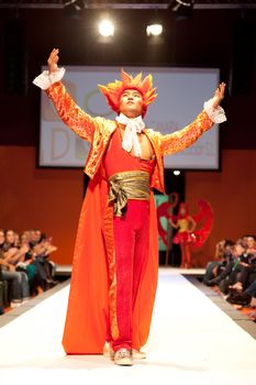 CANARY ISLANDS - 29 OCTOBER: Model on the catwalk wearing carnival costume from designer GC DC during Carnival Fashion Week October 29, 2011 in Canary Islands, Spain