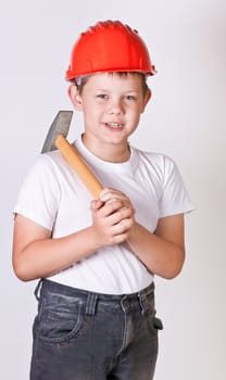 Portrait of a boy in a red protective helmet