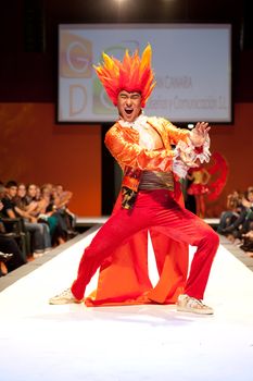 CANARY ISLANDS - 29 OCTOBER: Model on the catwalk wearing carnival costume from designer GC DC during Carnival Fashion Week October 29, 2011 in Canary Islands, Spain