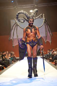 CANARY ISLANDS - 29 OCTOBER: Model on the catwalk wearing carnival costume from designer GC DC during Carnival Fashion Week October 29, 2011 in Canary Islands, Spain