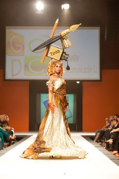 CANARY ISLANDS - 29 OCTOBER: Model on the catwalk wearing carnival costume from designer GC DC during Carnival Fashion Week October 29, 2011 in Canary Islands, Spain