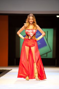 CANARY ISLANDS - 29 OCTOBER: Model on the catwalk wearing carnival costume from designer Agustin Munoz during Carnival Fashion Week October 29, 2011 in Canary Islands, Spain