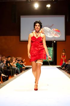 CANARY ISLANDS - 29 OCTOBER: Model on the catwalk wearing carnival costume from designer Agustin Munoz during Carnival Fashion Week October 29, 2011 in Canary Islands, Spain